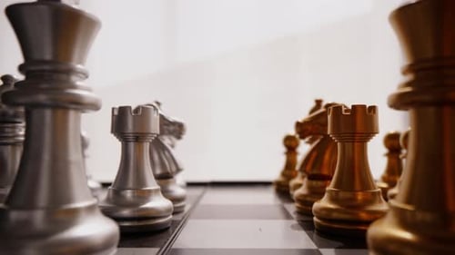 Metallic Chess Pieces Ready to Play a Game