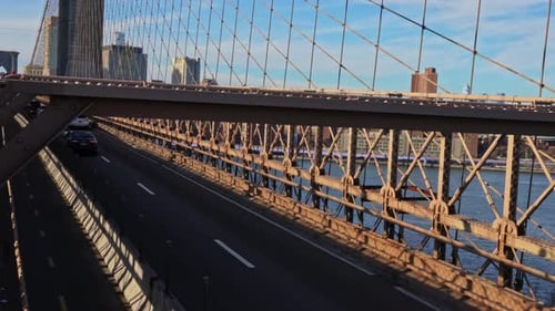 Traffic on iconic Brooklyn Bridge bridge across East river in New York City