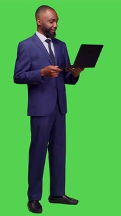 Vertical Video Side View of African American Man Attending Videocall Meeting on Pc