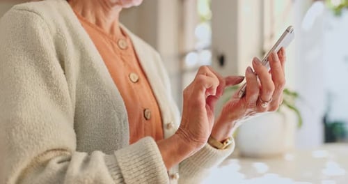 Senior Woman Using Smartphone Technology Close Up