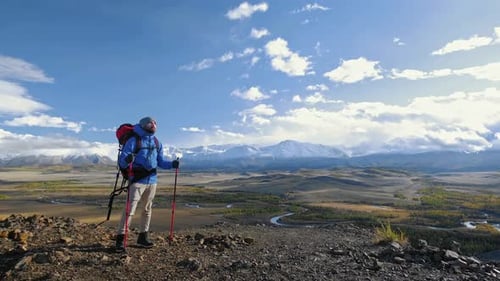 Hiker With Backpack Looking At Mountain Male with Bag at Wild Journey Climb Trek