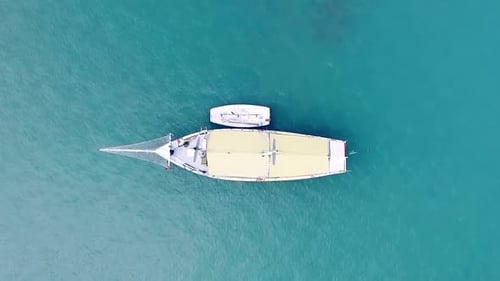 Top Down Aerial View of a Large Sailing Boat Gliding Through the Mediterranean