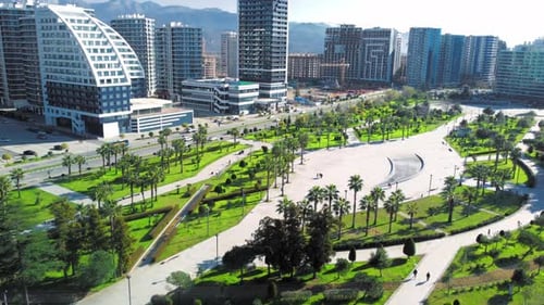 Resort town of Batumi in Georgia. Aerial view of green park on sunny day