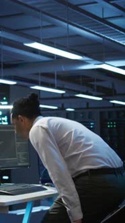 Vertical Video IT Professional in Server Hub Establishing Performance Benchmarks