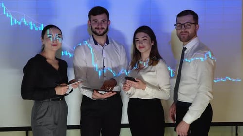 Corporate Successful Business Team of Traders Stands at Office with Stock Market Chart on Background