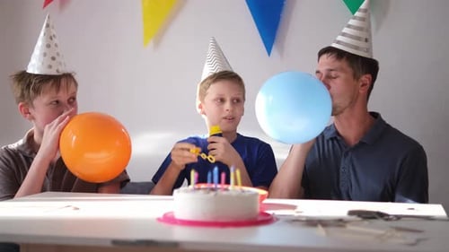 Festive Family Birthday Party with Balloons and Cake