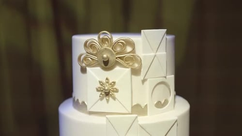 Elegant White and Gold Celebration Cake
