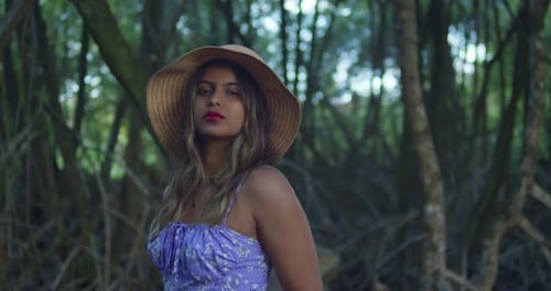 Stylish Woman Posing in Tropical Forest Setting