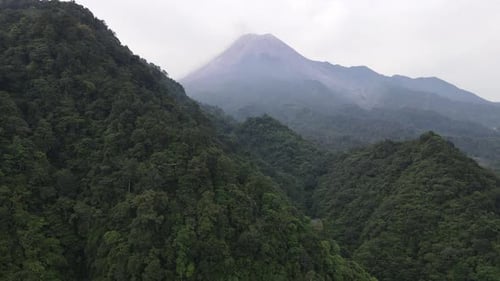 Aerial view of Merapi Mountain in indonesia with tropical forest around it