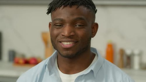 Smiling Young Man Looking at the Camera