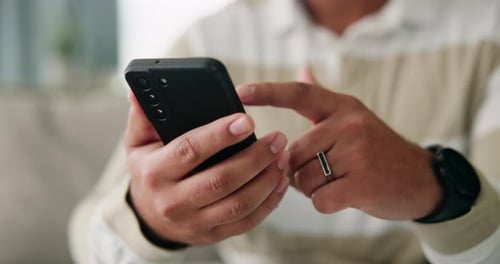 Man, hands and phone to scroll on website in home, research and social network for communication