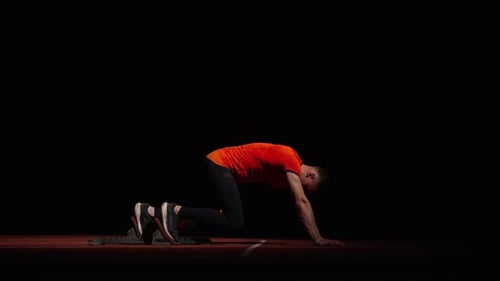 Runner Standing On Starting Blocks For Start Side View Of Sportsman Preparing To Sprint Race