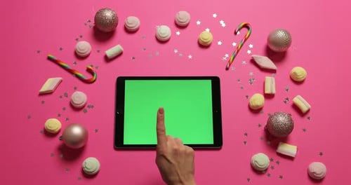 Hands Tapping Pages on Tablet with Green Screen