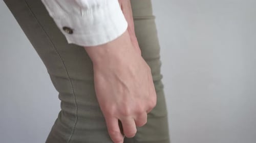 Woman Massaging Sore Knee Joint Pain