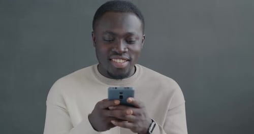 African American Man Messaging with Smartphone Recording Voice Message Sending