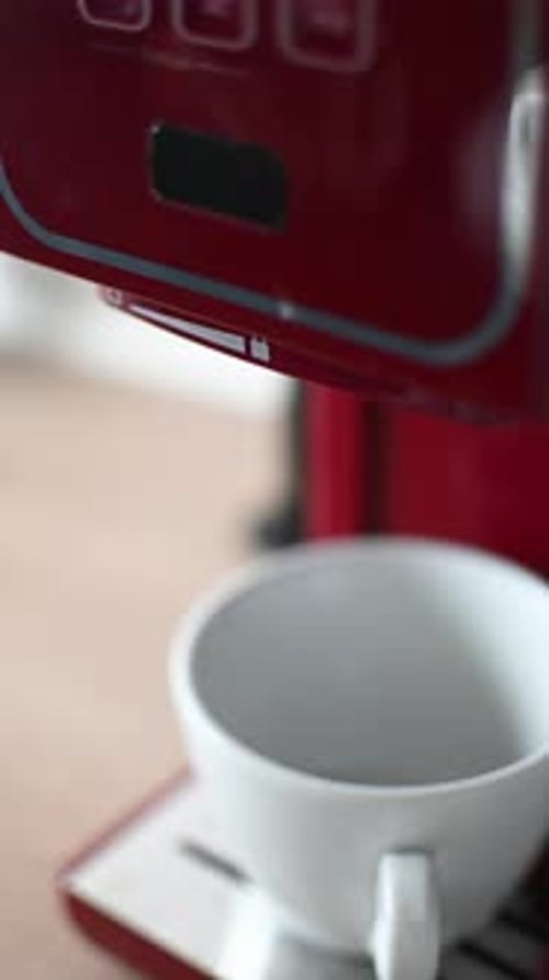 Preparing espresso coffee in a modern kitchen.