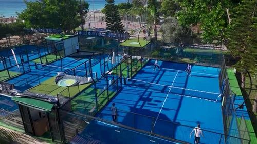 Aerial View Paddle Tennis Enthusiasts Enjoy Dynamic Matches and Lessons on Courts Overlooking the