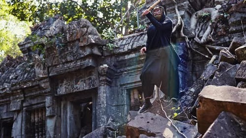 Masked Figure with Sword in Ancient Temple Ruins