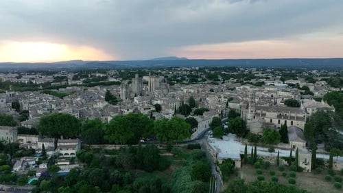 Historic Town Of Uzes At Sunset In Gard, Occitanie Region Of Southern France. Aerial Drone Shot