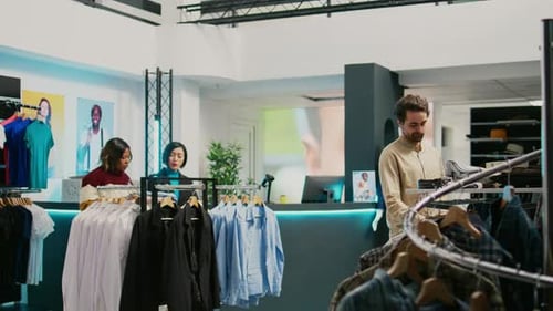 Retail Worker Helping Customer to Buy Shirts at Mall