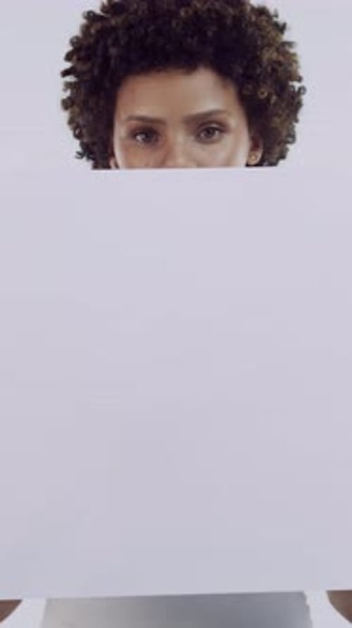 Woman, poster and face in studio with promotion, mock up space and afro on white background