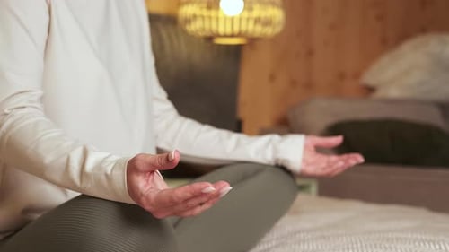 Woman Meditating for Health and Wellness at Home
