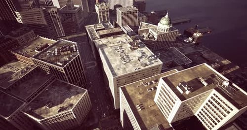 Aerial View of a Vibrant Cityscape with Diverse Building Designs and Structures