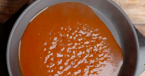 Thick Red Sauce Simmering in Pan