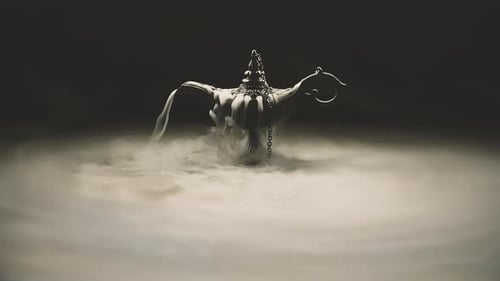 Mysterious Genie Lamp Emanating Smoke on Dark Set