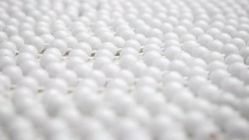 Uniform Rows of White Spherical Beads