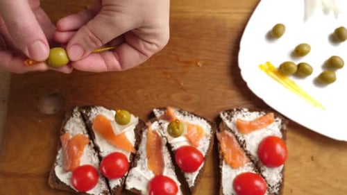 Making Delicious Open Faced Salmon Sandwiches with Olives