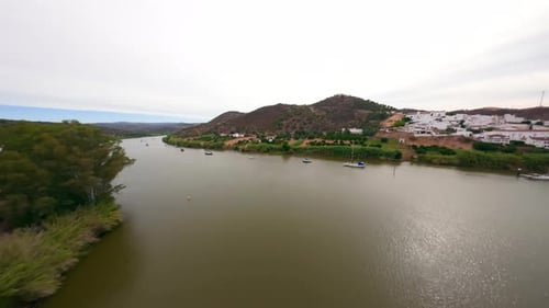 FPV Drone Flight Up to the Hill Crossing the River San Lucar De Guadiana Spain