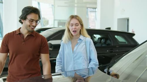 Young Couple Choosing SUV Car