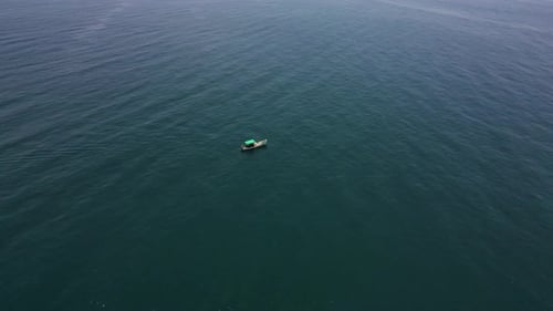 Small Boat on Ocean Surface