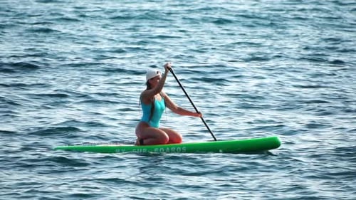 Sea Woman Sup Silhouette of Happy Positive Young Woman in Blue Bikini Surfing on Green SUP Board