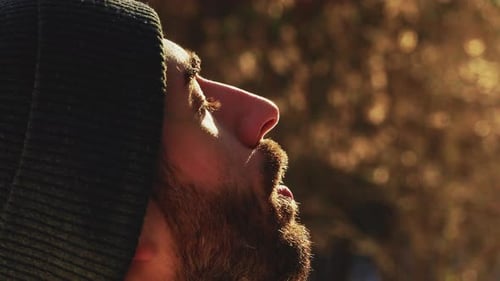 Man Relaxes in the Winter Forest