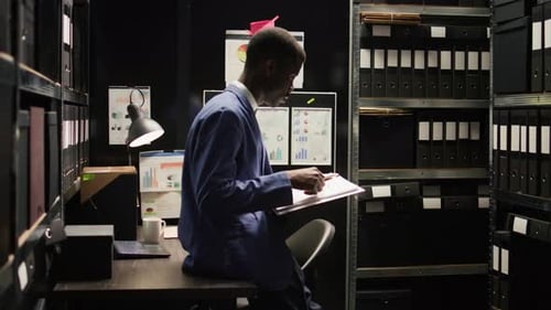 Man Reads Data in Small File Storage Office