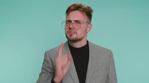 Man Scolding and Waving Finger