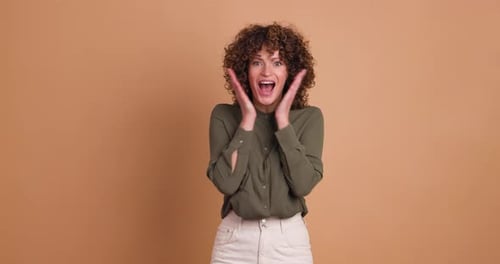 Woman Reacting with Surprise and Excitement in Studio