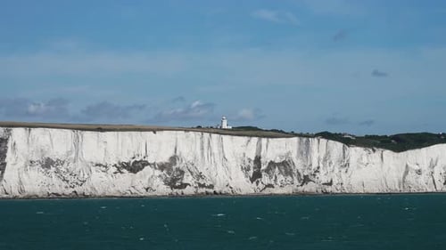 View From Ferry Showcasing Iconic White Chalk Cliffs Near Dover England With Serene Sea Reflecting