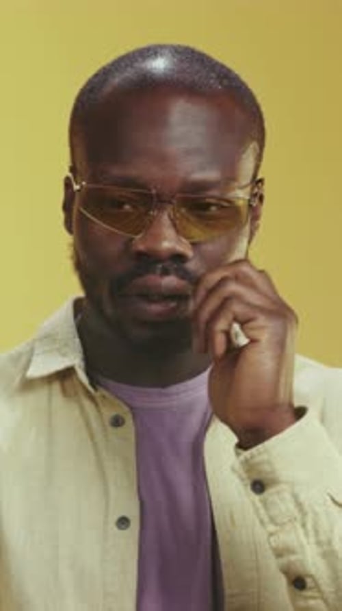 Man With Glasses Thinks of Great Idea and Reacts