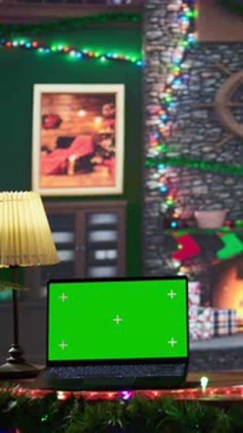 Vertical Video Father Christmas Reading Letters From Children Next to Green Screen Display