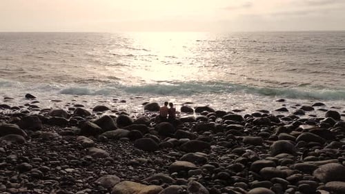 Idyllic scene of two people at unspoiled virgin beach in Gran Canaria, Spain during summer time on v
