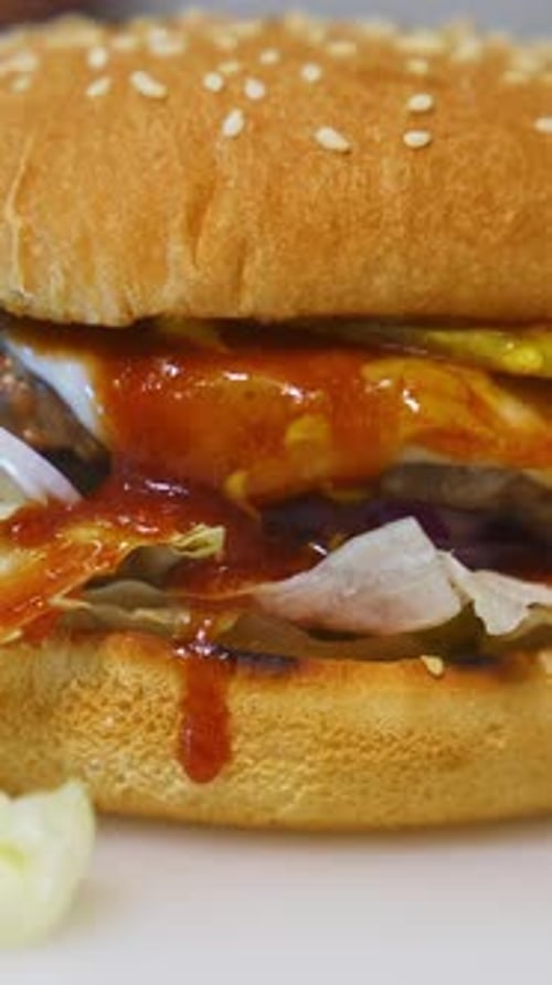 Amazing tasty appetizing burger with various fresh ingredients and buns. Fast food concept. Close up