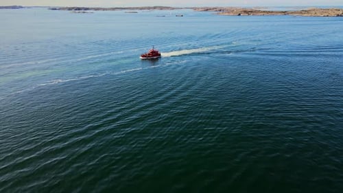 Red Swedish Pilot Boat Cruising In Skagerrak Strait Near Lysekil In Sweden. - aerial approach
