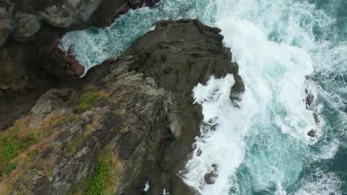 Drone View of Ocean Foam and Rocky Shoreline Texture