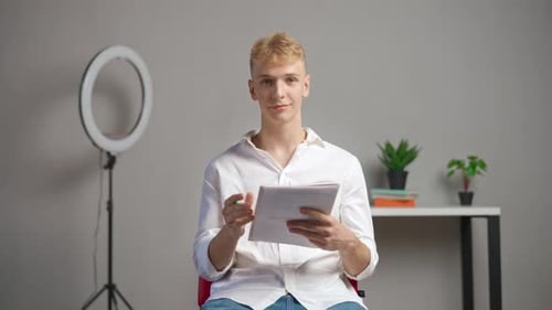 Man College Student Studying at Home Pov Sitting on Chair Listening Watching Lesson Online on