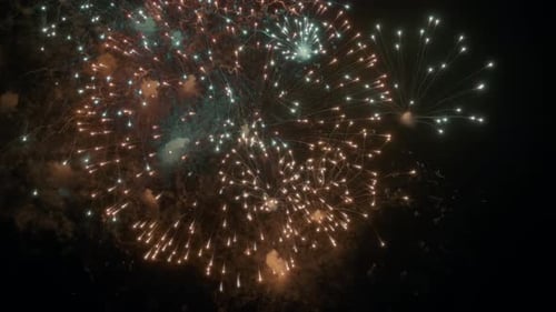 Beautiful fireworks display on the night sky background
