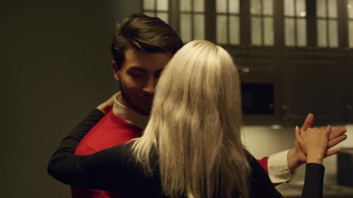 A couple shares an intimate dance moment