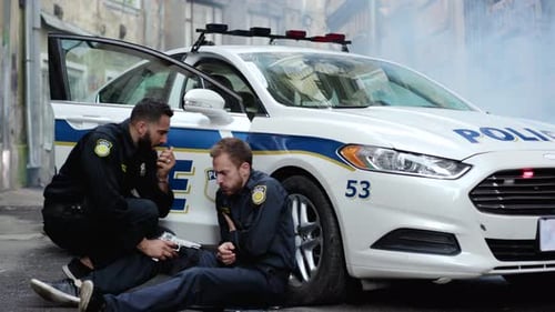 Police Officers at Crime Scene with Gun